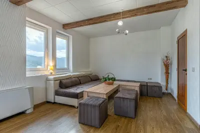 a living room with a couch and a table at Вила Звездопад in Manastir