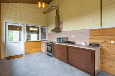 a kitchen with a counter and a stove top oven at Вила Звездопад in Manastir