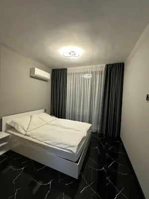 a bedroom with a bed and a window at Diamond Casa with Free Private Parking in Plovdiv