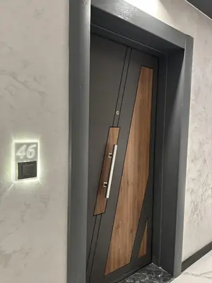 a wooden door in a wall with a sign on it at Diamond Casa with Free Private Parking in Plovdiv
