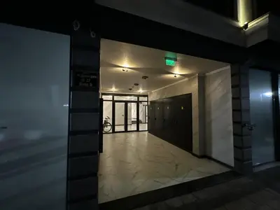 an empty hallway of a building with a green light at Diamond Casa with Free Private Parking in Plovdiv
