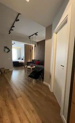 a living room with a couch and a table at 2-Bedroom Luxury Apartment in the center of Sofia in Sofia