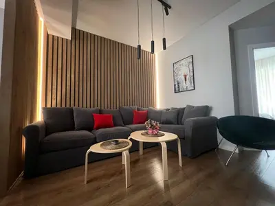 a living room with a couch and a table at 2-Bedroom Luxury Apartment in the center of Sofia in Sofia