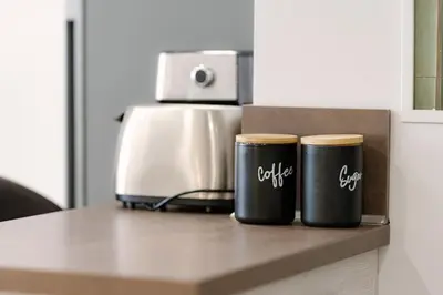 two coffee cups sitting on top of a counter at NDK - UrbanLux Medius 2BDR FREE Parking in Sofia