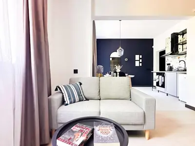 a living room with a couch and a table at Duplex Retreat 2 Studios Balconies, Wi-Fi in Sofia