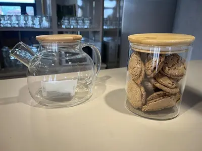 a jar filled with bread sitting on top of a table at Delight House in Samokov