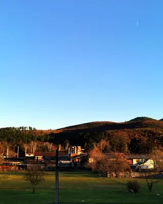 a view of a field with a mountain in the background at Апартамент Релакс in Velingrad