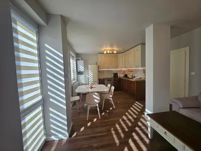 a kitchen and dining room with a table and chairs at Iglika 2, A13 & A14 in Borovets