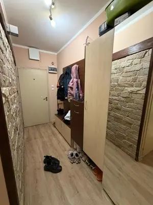 a room with a hallway with a stone wall at Abdovica House in Sofia