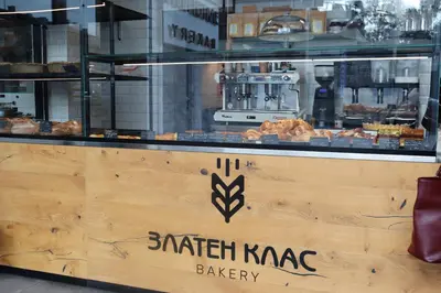 a bakery with a counter with pastries on it at Sunny Penthouse with Mountain Views and 180 degrees Terrace in Sofia