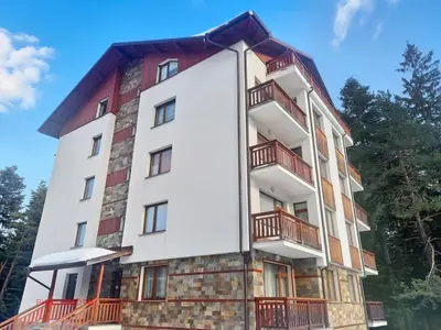 a building with balconies on the side of it at Rila Morning in Borovets