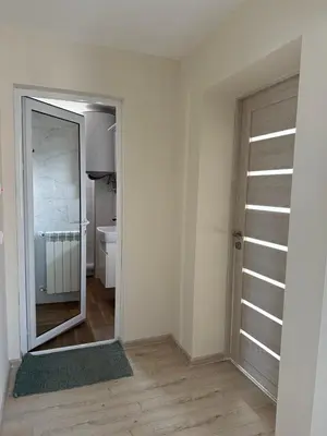 an empty room with a mirror and a bathroom at The Walnut Nest in Sapareva Banya