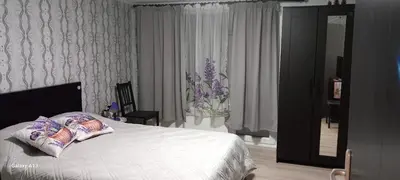 a bedroom with a bed with two pillows on it at Бутикови стаи за гости- Felicita in Kyustendil