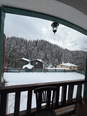 a view of a snow covered yard from a balcony at Happy House Progled in Progled