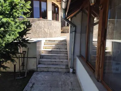 a set of stairs leading up to a building at Къща за гости Свети Георги in Pamporovo