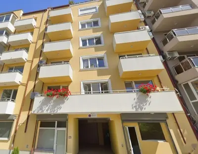 an apartment building with flowers on the balconies at Cozy Central Apartment-Welcome Coffee and Wine in Sofia