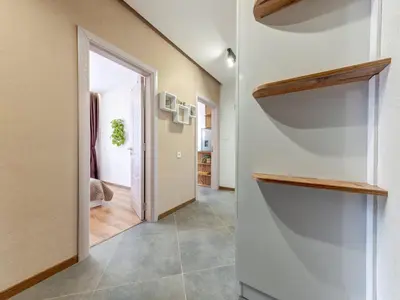 a hallway with a door leading into a room at Stylish 1BR in the Heart of Town in Smolyan