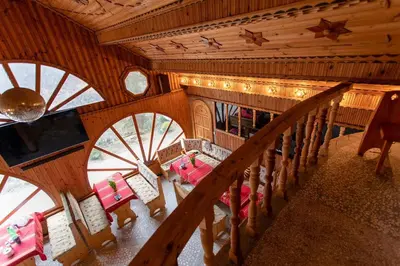 an overhead view of a room with tables and chairs at Къща за Гости Слънце in Breze