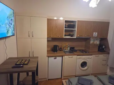 a kitchen with a sink and a washing machine at Smart Budget Stay at Sofia Centre by NDK and Vitosha Blvd in Sofia