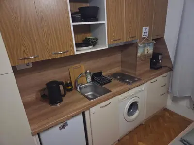a kitchen with a sink and a washing machine at Smart Budget Stay at Sofia Centre by NDK and Vitosha Blvd in Sofia