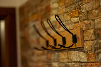 a lightswitch attached to a brick wall at Two Vintage Apartments by NDK and Vitosha Blvd with Free Parking in Sofia