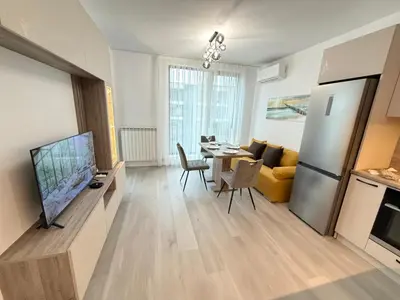 a living room with a kitchen and a dining room at Cusco Cozy Apt w Parking Spot near Paradise Mall and WiFI in Sofia