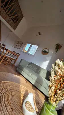 a living room with a couch and a table at Cottage for 4 people 30 in Sofia