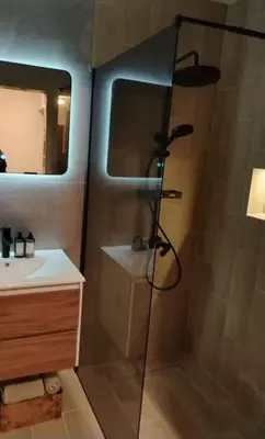 a bathroom with a shower and a sink at AMur Deluxe Apartment in Sofia