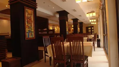 a dining room with tables and chairs in a restaurant at Your studio at Winslow Infinity in Bansko