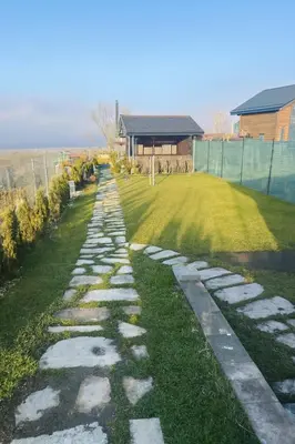 a stone path in the yard of a house at Къща за гости Касида in Sapareva Banya