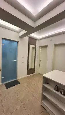 an empty room with a door and a tile floor at Bonnie's Stylsih 2BR Home near the Palace in Sofia