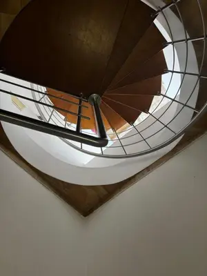 a view of a spiral staircase in a building at Къща за гости Стиляна in Devin