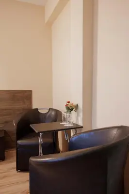 a restaurant with a table and two chairs at Trafi Em in Sofia
