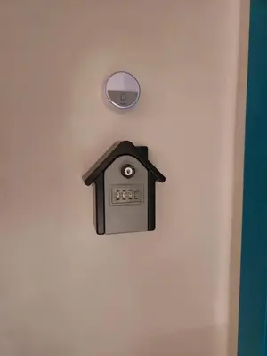 a clock on a wall with a house on it at Green view 180 in Troyan