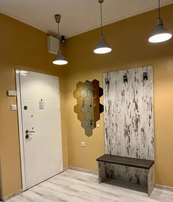 a room with a door and a bench and a wall at Flower home 1 in Sofia