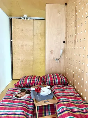 a room with two beds and a table with a plate on it at Flower home 5 in Sofia