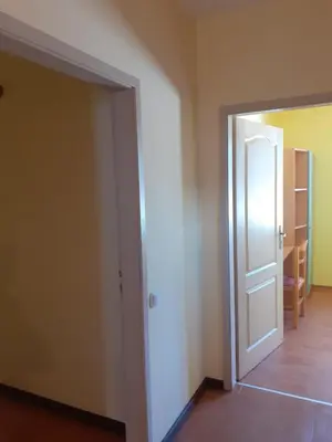 an empty room with a door and a hallway at Вилно селище Баташки хан in Tsigov Chark
