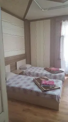 a bedroom with two beds and a window at Hostel Alex 1 in Sofia