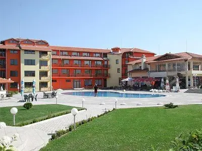 a large building with a pool in front of a building at Hotel Grand in Samokov