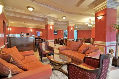 a living room with couches and chairs and a table at Grand Monastery Pamporovo Apartment 5B23 in Pamporovo