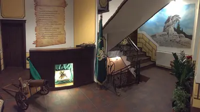 a room with a fireplace and stairs in a building at Stoichkovata Kashta Koprivshtitsa in Koprivshtitsa