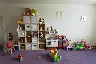 a room with a shelf with stuffed animals and toys at Amira Boutique Hotel in Bansko