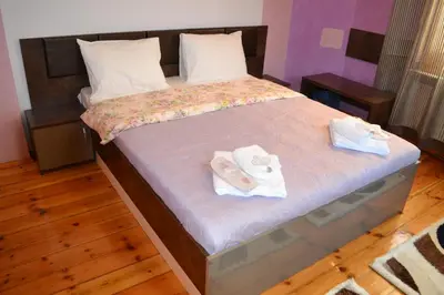 a bedroom with a bed with towels on it at Guest House Secession Style in Sofia