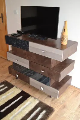 a entertainment center with a television on top of it at Guest House Secession Style in Sofia