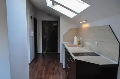 a kitchen with a sink and a counter top at Apartment Elegant in Velingrad