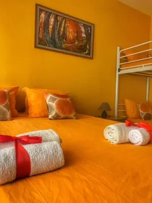 a bedroom with a bed with towels on it at Hotel Forest Star on the Ski Slope in Borovets