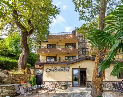 a building with a sign that reads albuquerque at Eco Hotel Momata in Kolarovo