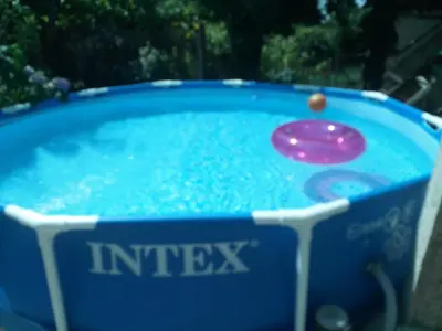 a hot tub with a frisbee in it at Guest House Emiliya in Ovchartsi