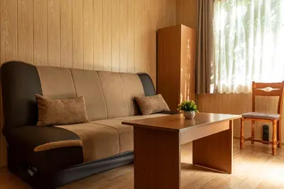 a living room with a couch and a table at Camping Verila in Sapareva Banya