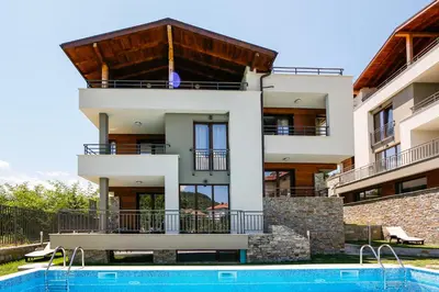 a house with a swimming pool in front of it at Twin House in Ognyanovo